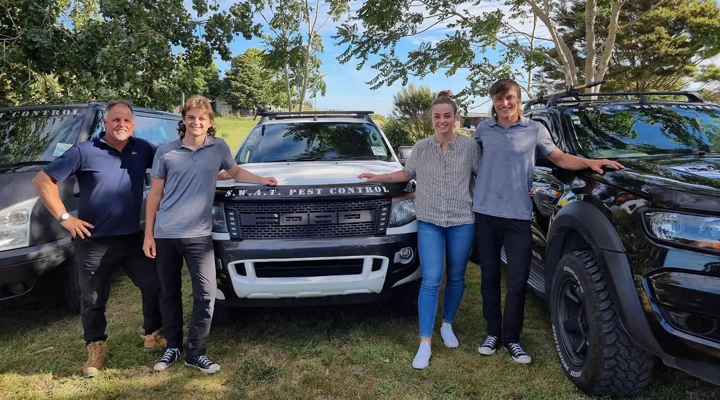 SWAT Pest Control Team and Vans